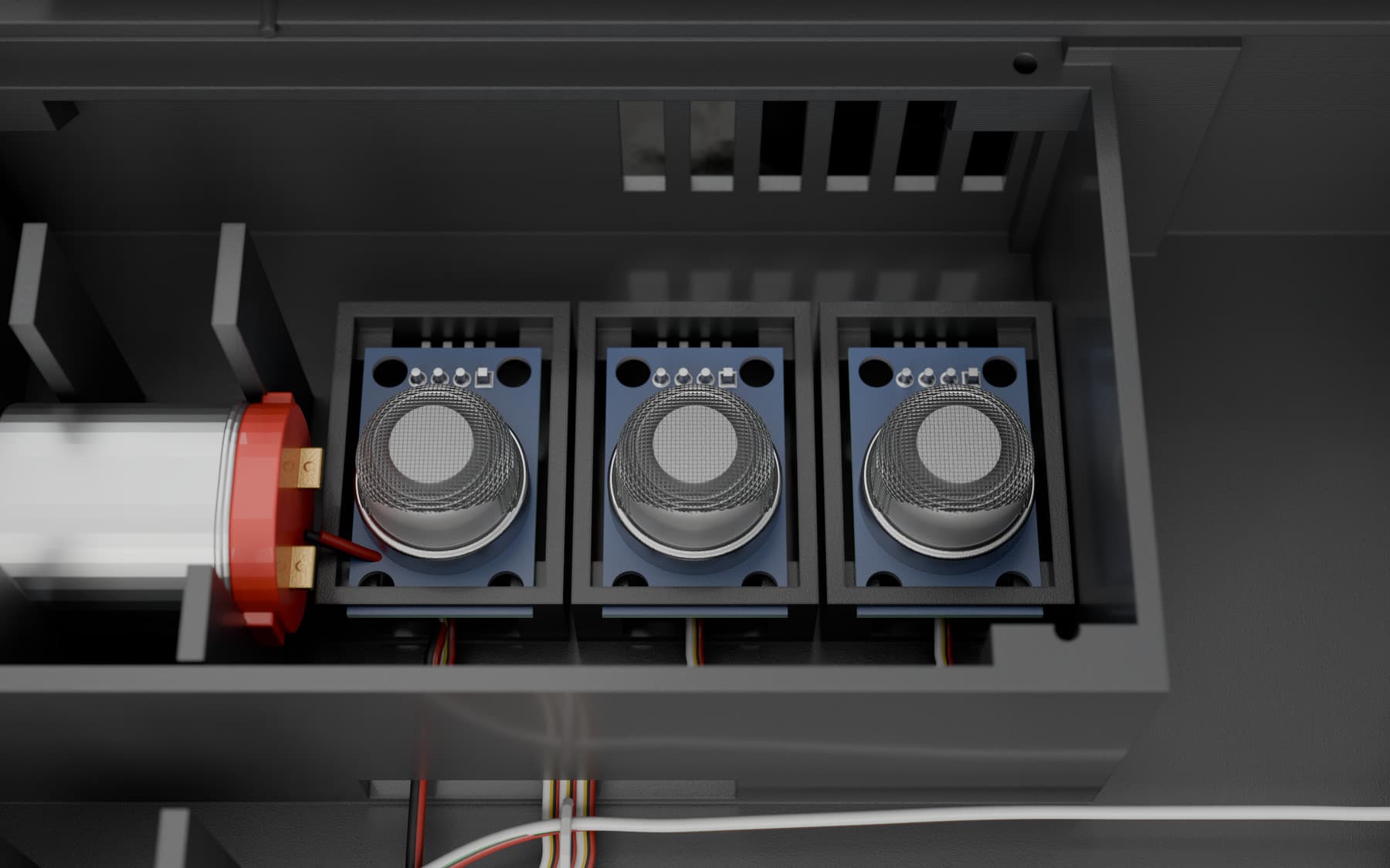 Close view of the gas-sensing gas sensing modules on an Alfa HazardX hazard detection device, their woven steel caps lit from the side.